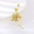  Arannyal bevont magnólia virágszál bross aranybarna CZ kristályokkal (0007.)